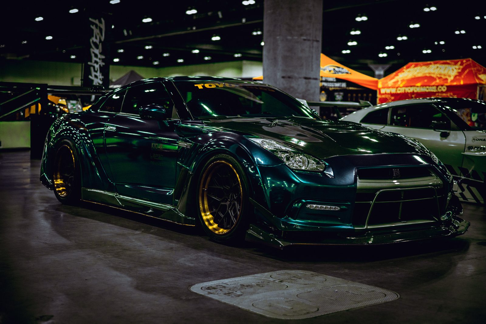 Finished automotive film frame — green widebody build
